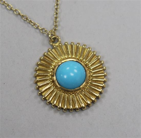 A modern 18ct gold and cabochon turquoise set disc pendant, on a continental yellow metal chain, pendant 22mm.